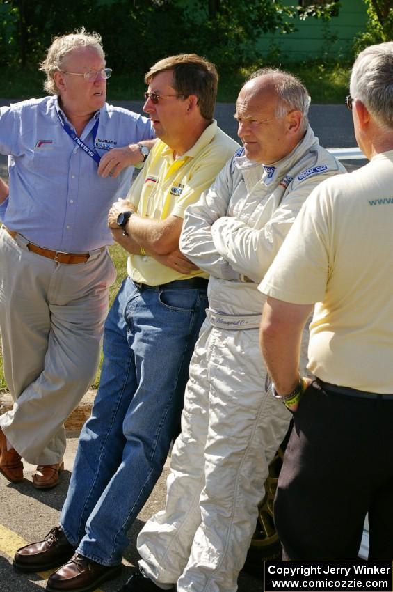 Stig Blomqvist and crew relax before the start of the rally on day one.