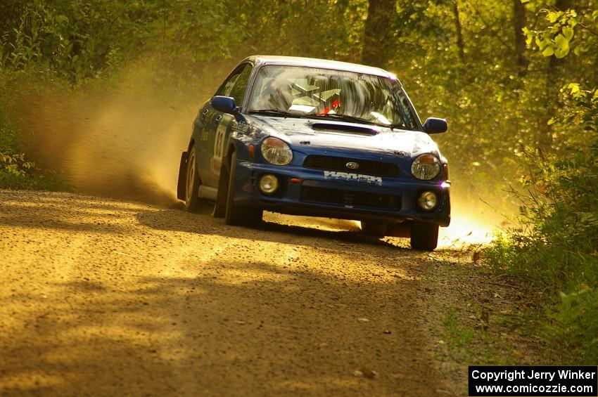 Mark Utecht / Rob Bohn Subaru WRX drifts beautifully through a fast sweeper on Halverson Lake, SS1.