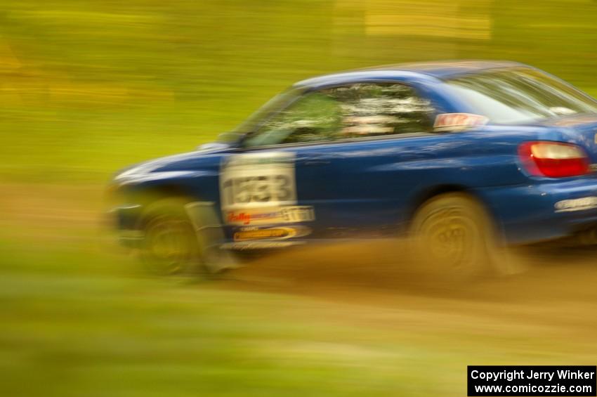 Eric Langbein / Jeremy Wimpey Subaru WRX at speed on Halverson Lake, SS1.