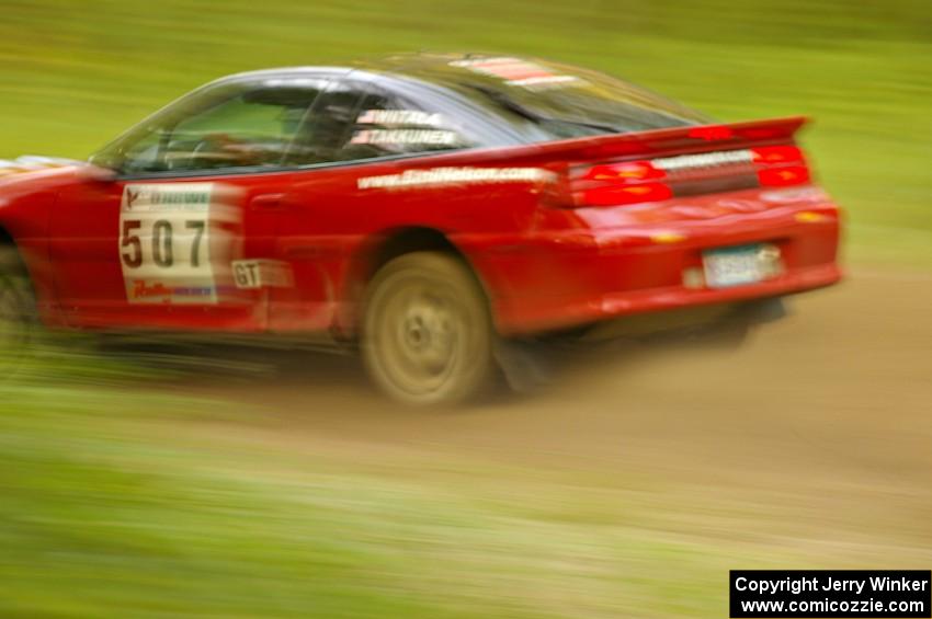 Micah Wiitala / Jason Takkunen Mitsubishi Eclipse GSX at speed down a straight on Halverson Lake, SS1.