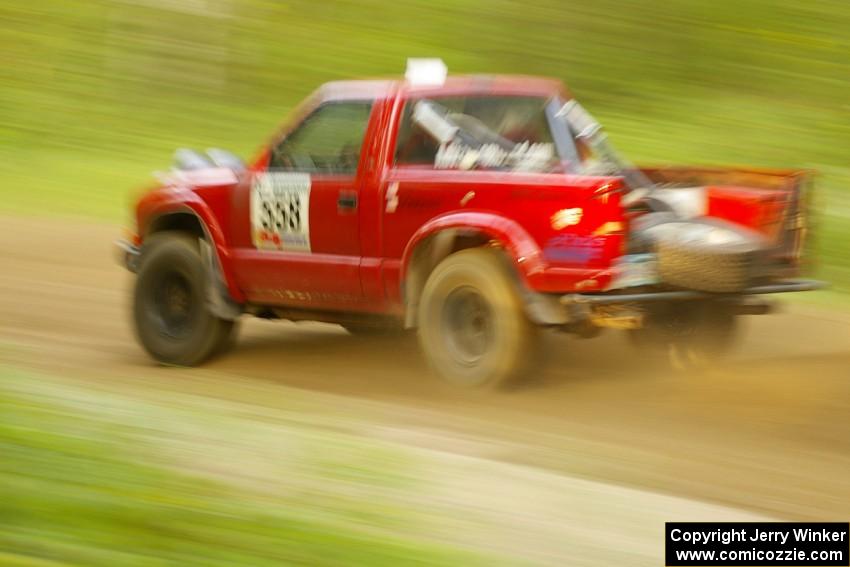 Jim Cox / Richard Donovan Chevy S-10 at speed down a straight on Halverson Lake, SS1.