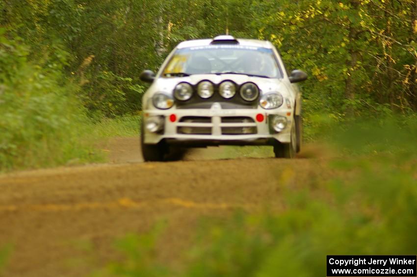 Bruce Davis / Jimmy Brandt Dodge SRT-4 comes over a crest near the finish of SS1, Halverson Lake.