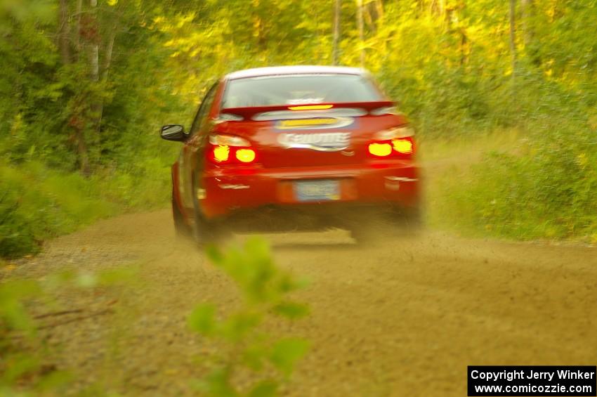 John Cirisan / Josh Hamacher Subaru WRX at speed through the final right-hand sweeper on Halverson Lake, SS1.