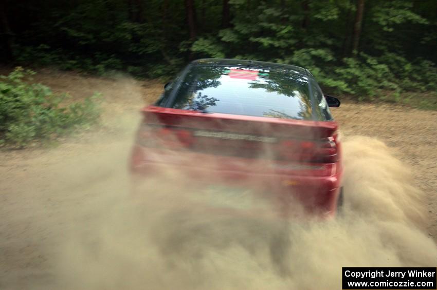 Micah Wiitala / Jason Takkunen Mitsubishi Eclipse at speed through a left-hander on SS1.