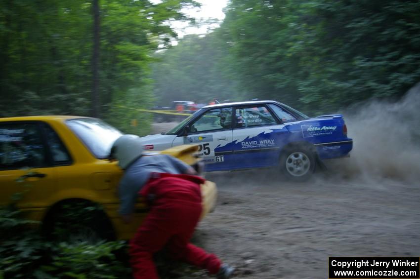 Mike Wray / John Nordlie Subaru Legacy Sport blasts past the stuck Mitsubishi Galant of Erik Payeur / Adam Payeur on SS1.
