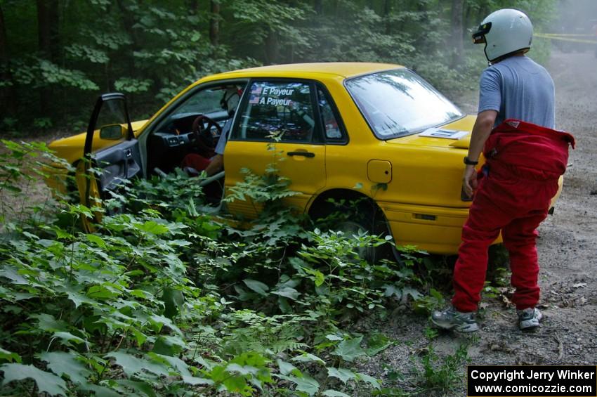 Erik Payeur / Adam Payeur Mitsubishi Galant got stuck atop a boulder at the apex of a corner on SS1 (1).