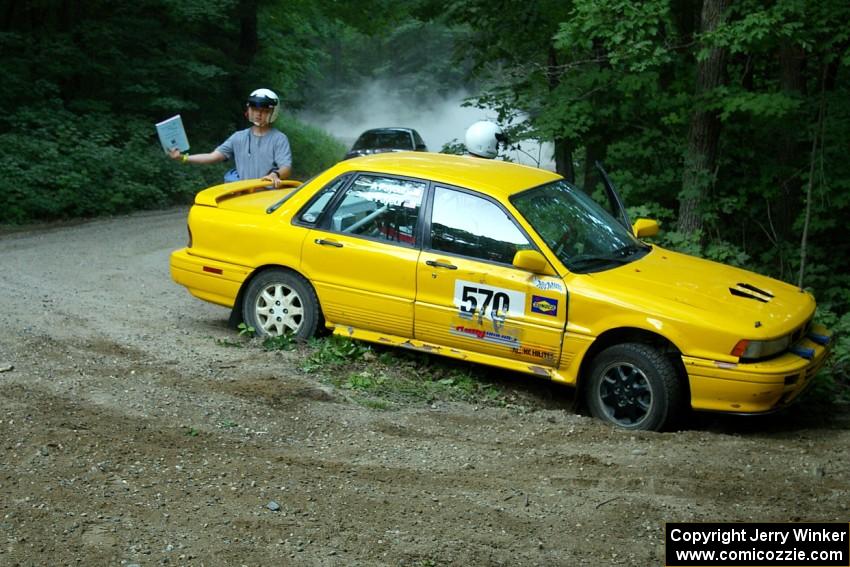 The stuck Erik Payeur / Adam Payeur Mitsubishi Galant flashes the OK sign to the Ryan Johnson / Matt Himes Saturn SL2.