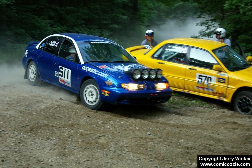 Ryan Johnson / Matt Himes Saturn SL2 passes the stuck Erik Payeur / Adam Payeur Mitsubishi Galant on SS1. Both later DNF'ed.