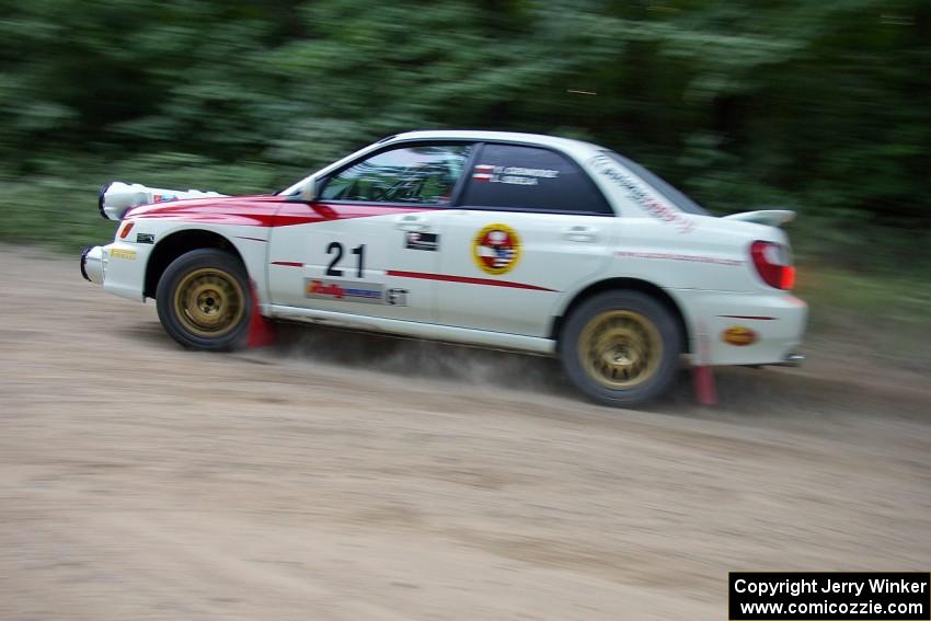 Yurek Cienkosz / Lukasz Szela Subaru Impreza RS prepares for a hairpin on SS1.