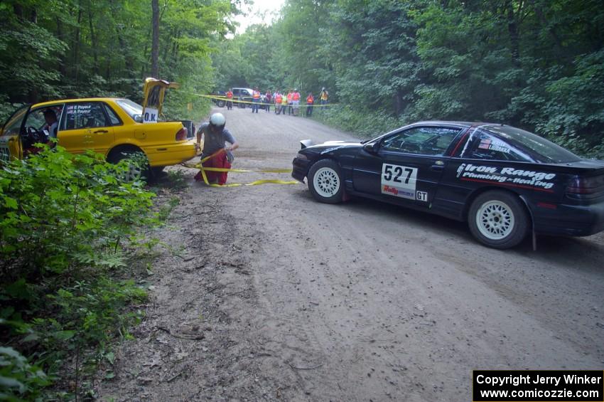 Craig Walli / Jonah Liubakka Eagle Talon frees the Erik Payeur / Adam Payeur Mitsubishi Galant off the boulder on SS1.