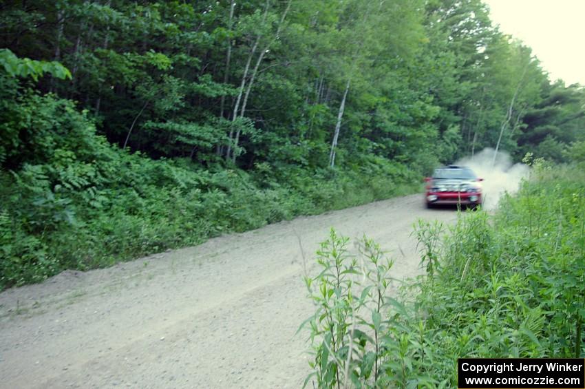 Cary Kendall / Scott Friberg exit out of a a left-hand sweeper onto a straight on SS2 in their Eagle Talon.