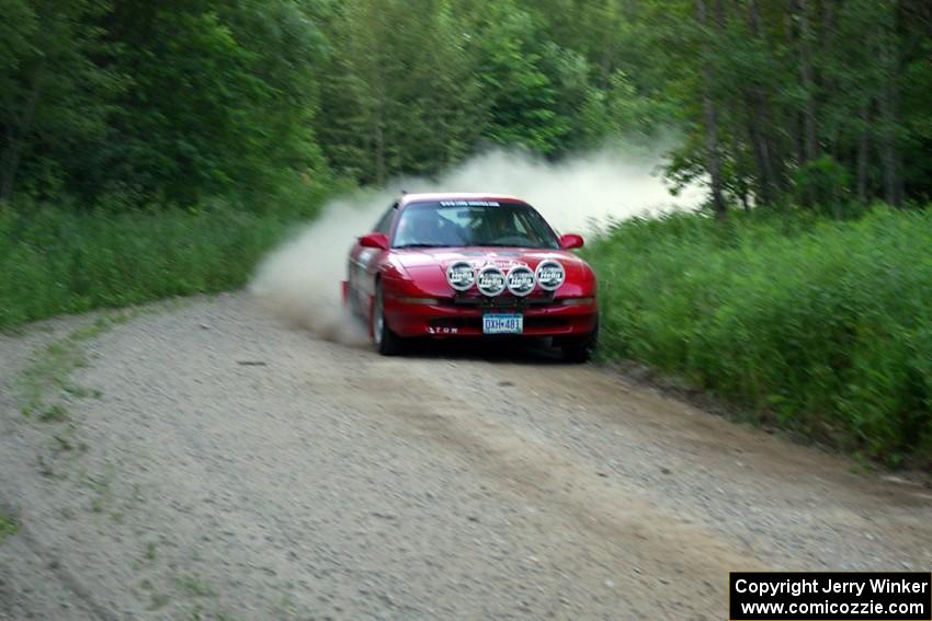 Erick Nelson / Greg Messler Ford Probe GT through a fast left-hand sweeper on SS2.