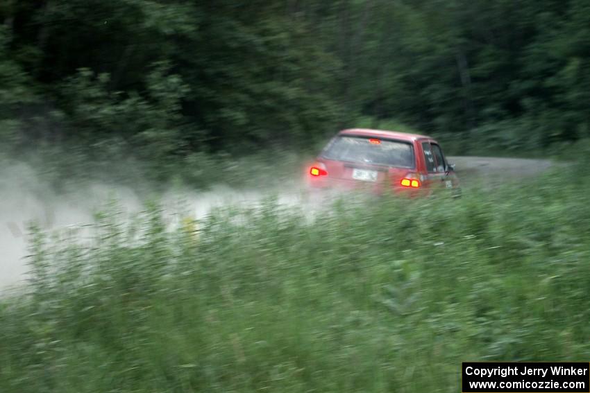 Paul Koll / Matt Wappler VW GTI at speed on a straight on SS2 at sundown.