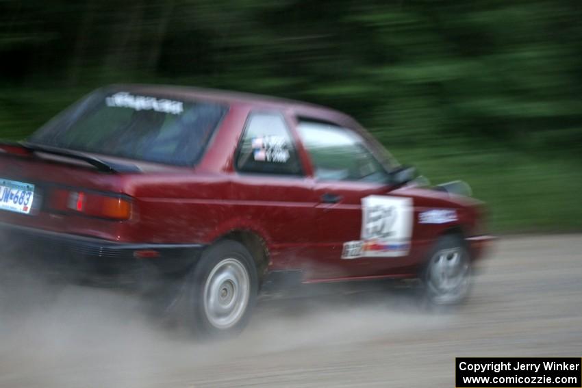 Rob Stroik / Ross Wegge Nissan Sentra SE-R at speed on a straight on SS2.