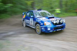 Travis Pastrana / Christian Edstrom Subaru WRX STi drifts through a 90-right on SS2, Spur 2.