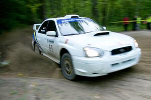 Stig Blomqvist / Ana Goni drift their Subaru WRX STi beautifully through a 90-right on SS2, Spur 2.