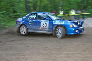 Mark Utecht / Rob Bohn Subaru WRX drifts wide at a 90-right on SS2, Spur 2.