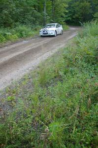 Tim Paterson / John Allen Mitsubishi Lancer Evo VIII blasts uphill out of a 90-right on SS2, Spur 2.