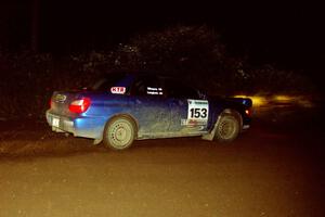 Eric Langbein / Jeremy Wimpey Subaru WRX drifts through a 90-left on SS7, Blue Trail.
