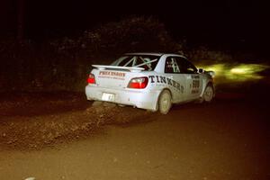 Fintan McCarthy / Noel Gallagher Subaru WRX STi sling gravel at a 90-left on SS7, Blue Trail.