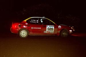 Scott Parrott / Breon Nagy Dodge Neon at speed through a 90-left on SS7, Blue Trail.