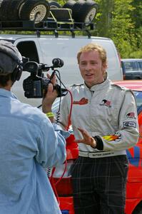 Matthew Johnson is interviewed prior to the start of the Bemidji Speedway stage.