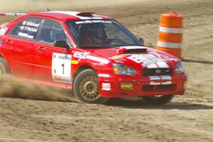 Pat Richard / Nathalie Richard Subaru WRX STi drifts out of the high-bank down to the infield on Bemidji Speedway, SS8.