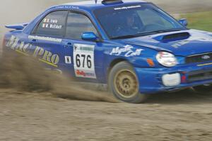 Mark McElduff / Damien Irwin Subaru WRX STi spits gravel through the infield at the Bemidji Speedway, SS8.