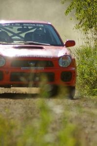 Matthew Johnson / Wendy Nakamoto Subaru WRX at speed on SS10, Chad's Yump.