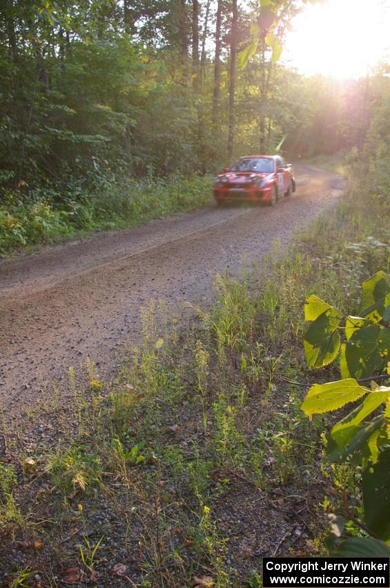 Matthew Johnson / Wendy Nakamoto Subaru WRX at speed on an uphill section of SS2, Spur 2.