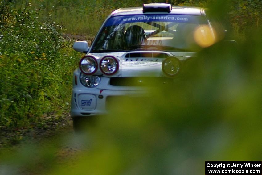 Fintan McCarthy / Noel Gallagher Subaru WRX STi rockets uphill on a fast section of SS2, Spur 2.