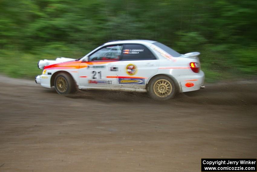Yurek Cienkosz / Lukasz Szela Subaru Impreza RS drifts through a 90-right on SS2, Spur 2.