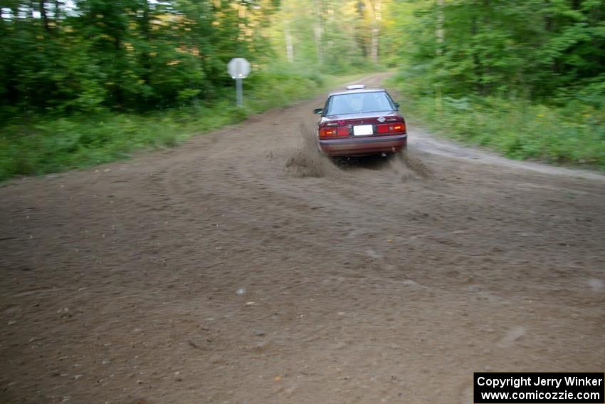 Ben Hanka / John Nordlie Mazda Protege drifts the back end through a 90-right on SS2, Spur 2.
