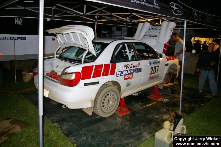 Dave Hintz / Rick Hintz Subaru WRX gets serviced in Akeley after the first set of stages on day one.