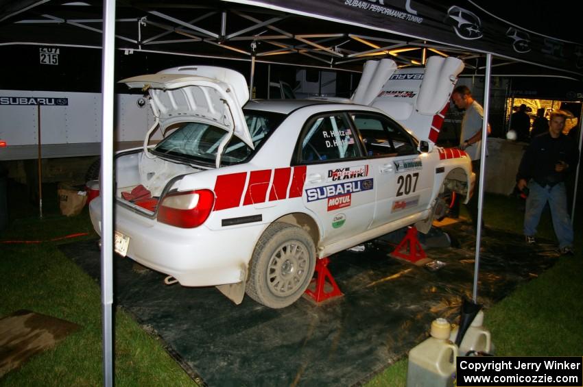 Dave Hintz / Rick Hintz Subaru WRX gets serviced in Akeley after the first set of stages on day one.