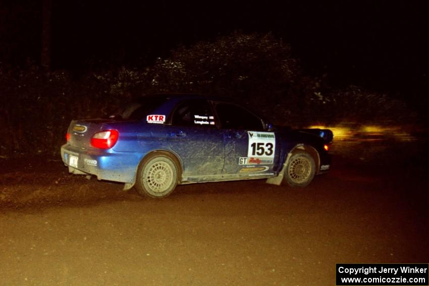 Eric Langbein / Jeremy Wimpey Subaru WRX drifts through a 90-left on SS7, Blue Trail.
