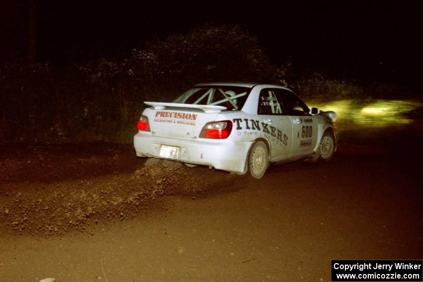 Fintan McCarthy / Noel Gallagher Subaru WRX STi sling gravel at a 90-left on SS7, Blue Trail.