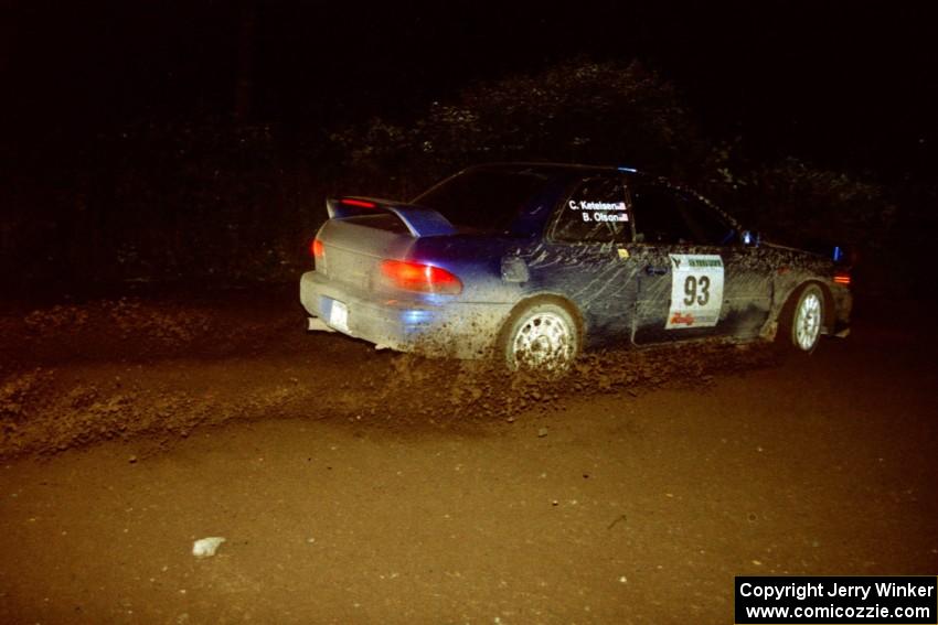 Bob Olson / Conrad Ketelson Subaru 2.5RS drifts through a 90-left on SS7, Blue Trail.