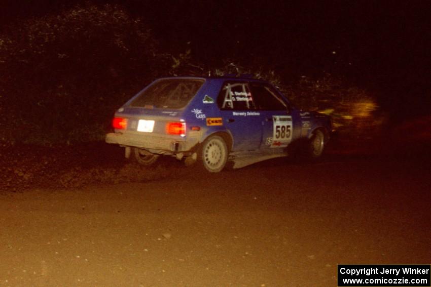 Dave Sterling / Stacy Sterling Dodge Omni GLH at speed through a 90-left on SS7, Blue Trail.