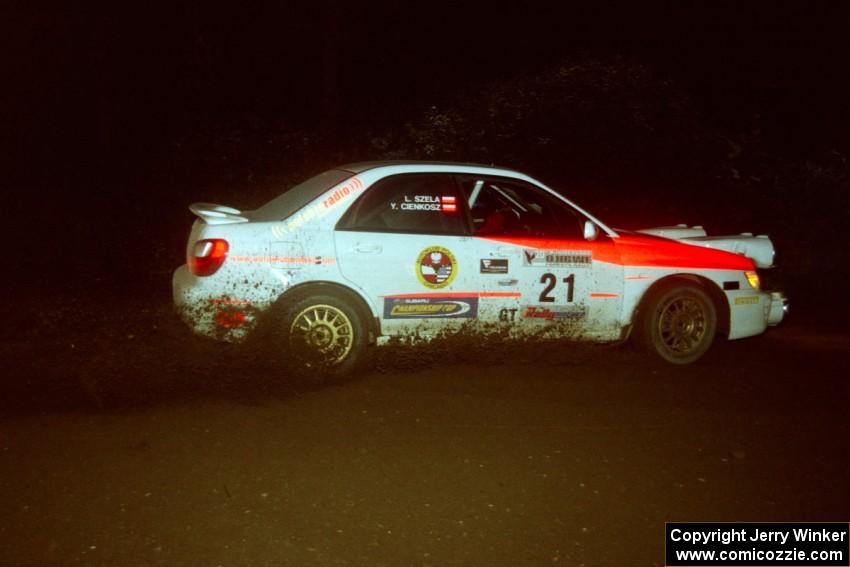 Yurek Cienkosz / Lukasz Szela Subaru Impreza RS drifts through a 90-left on SS7, Blue Trail.