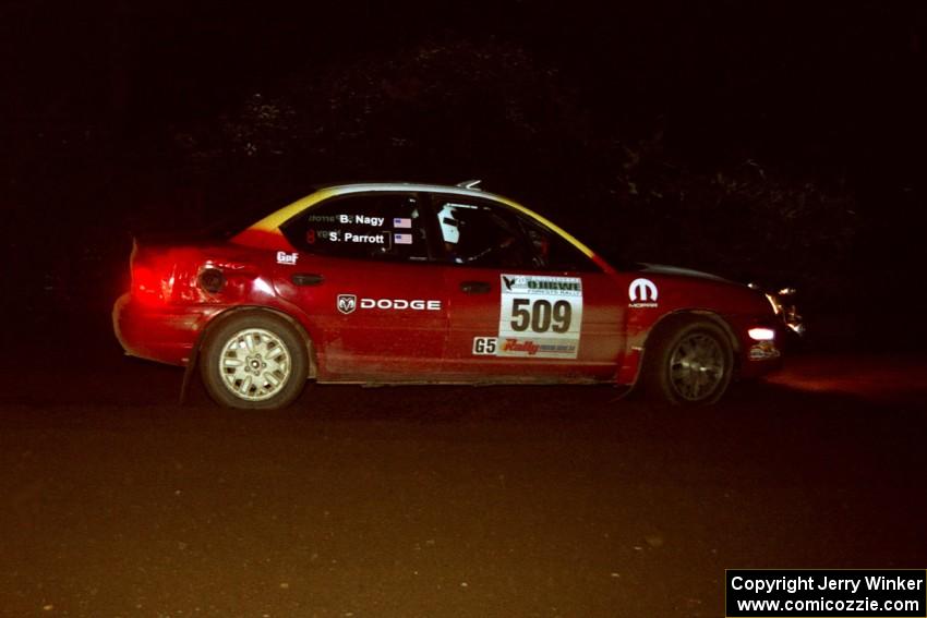 Scott Parrott / Breon Nagy Dodge Neon at speed through a 90-left on SS7, Blue Trail.