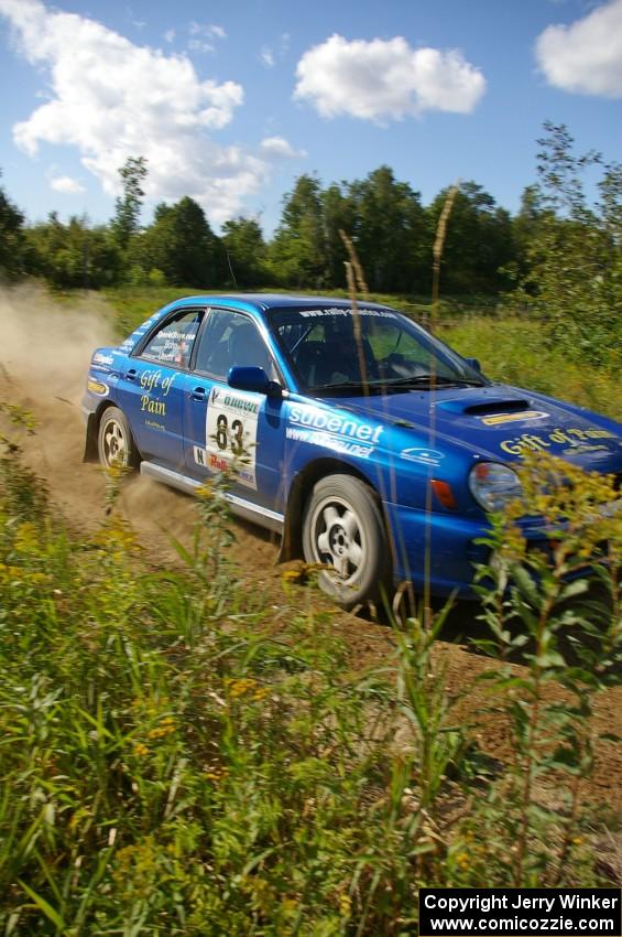 Mark Utecht / Rob Bohn Subaru WRX at speed through one of the fastest sections on SS10, Chad's Yump.