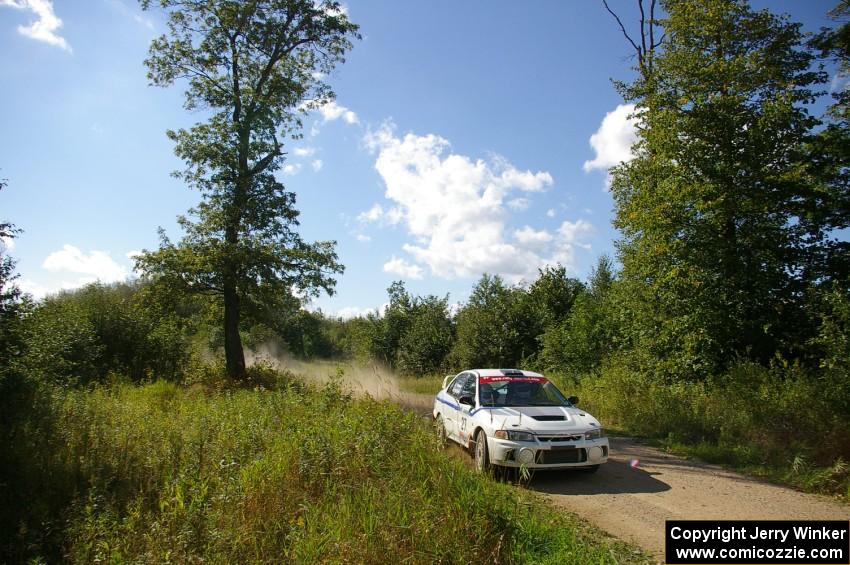Chris Gilligan / Joe Petersen Mitsubishi Lancer Evo IV at speed through the picturesque White Earth State Forest.
