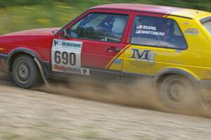 Carl Seidel / Jay Martineau VW GTI goes through an uphill left on SS10, Chad's Yump.