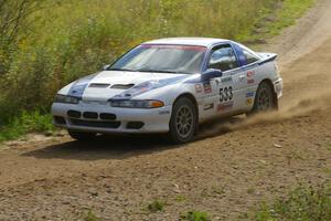 Paul Ritchie / Drew Ritchie Mitsubishi Eclipse GSX at speed through a fast uphill sweeper on SS10, Chad's Yump.