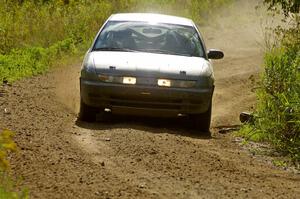 Dan Adamson / Jeremiah Schubitzke Saturn SL2 goes through a left sweeper on SS10, Chad's Yump.