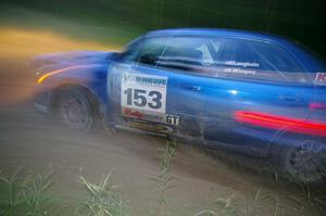 Eric Langbein / Jeremy Wimpey Subaru WRX at dusk through the spectator point on SS13, Sockeye Lake.