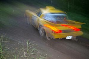 Jake Himes / Matt Himes Mazda RX-7 at speed through through the spectator point on SS13, Sockeye Lake.