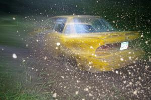 Erik Payeur / Adam Payeur Mitsubishi Galant sprays gravel through the spectator point on SS13, Sockeye Lake.