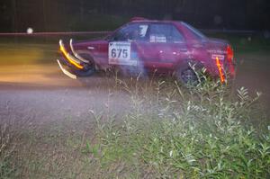 Ben Hanka / John Nordlie Mazda Protege goes through the spectator point on SS13, Sockeye Lake.